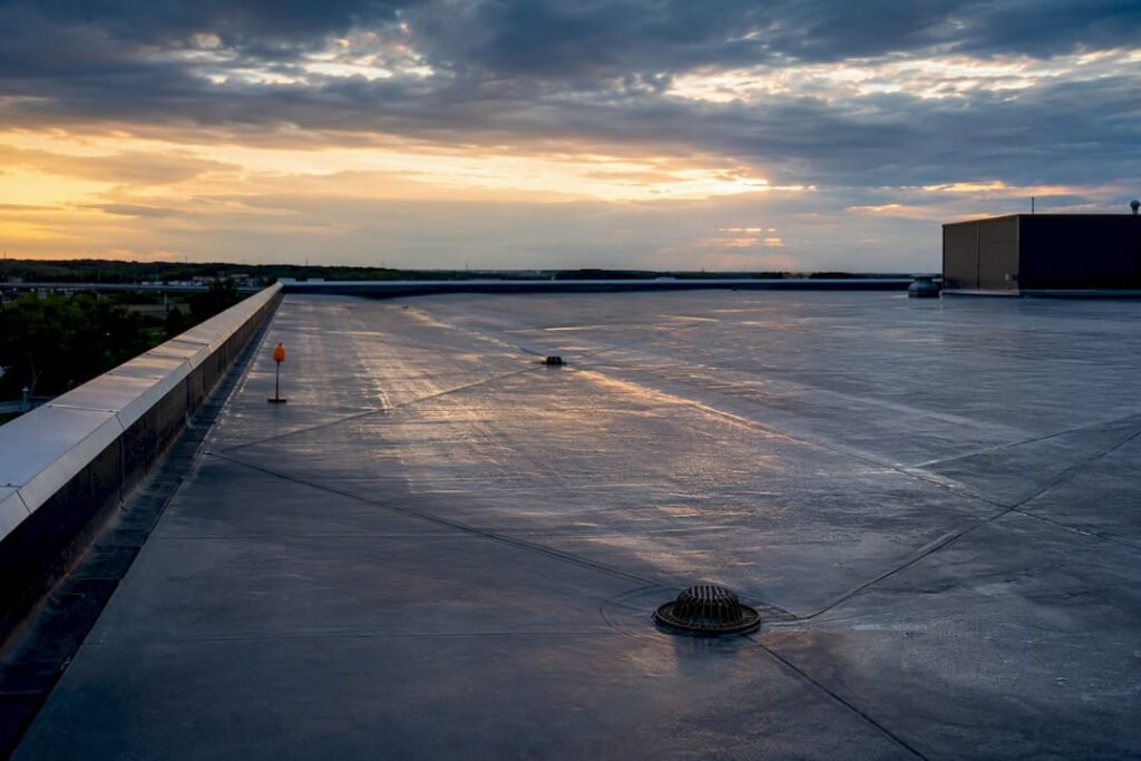 Commercial rooftop drainage layout at dusk